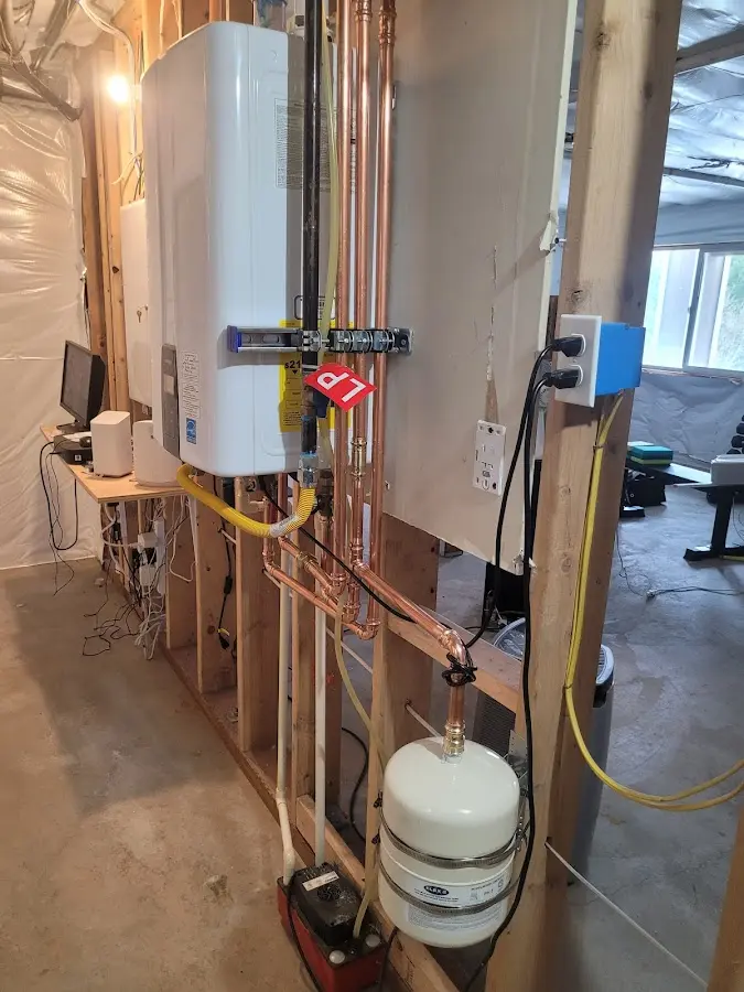 Licensed plumber repairing a kitchen sink in Needville