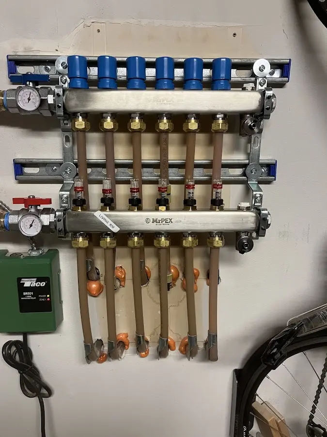 Plumber performing Water Heater Repair at a residential property in Needville